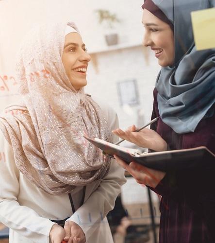 two ladies making notes